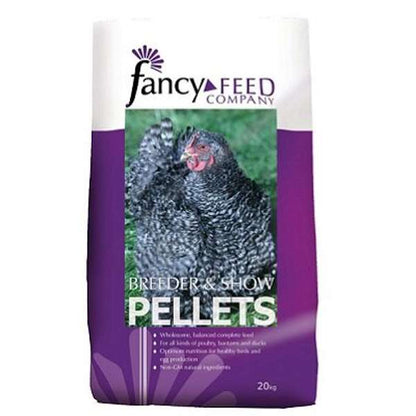 A bag of Fancy Feeds Breeder & Show Pellets with a picture of a chicken on the label.