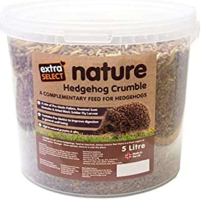A 5-liter clear plastic tub of extra select Nature Hedgehog Crumble complementary feed for hedgehogs, filled with brown crumbly feed and featuring a brown label.